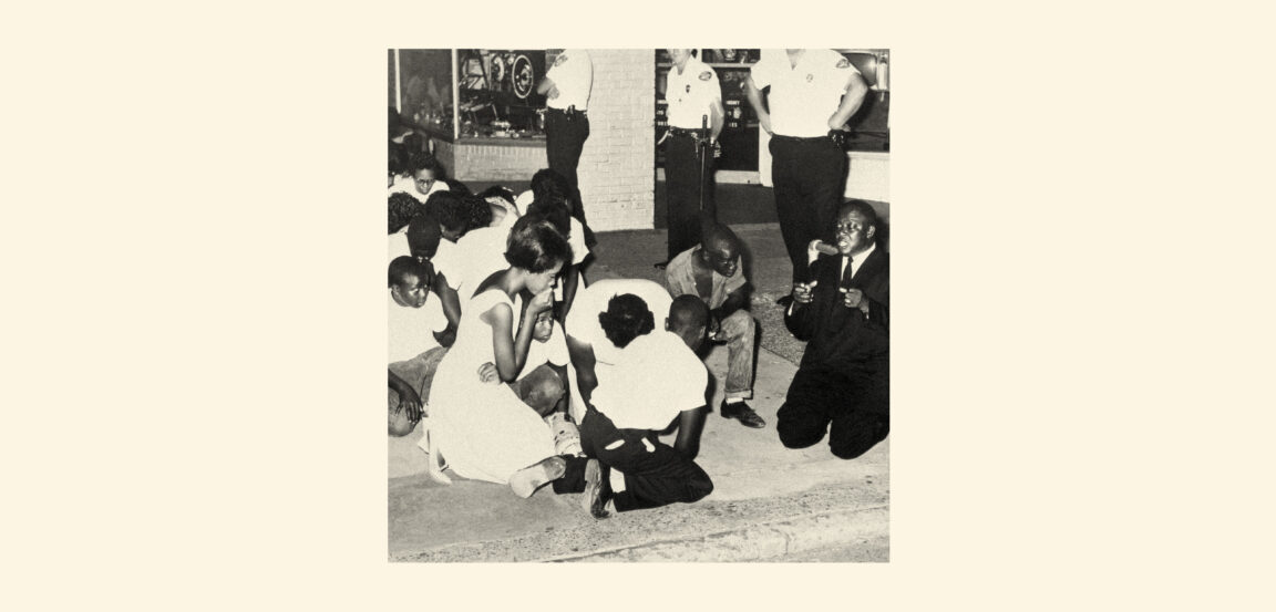 picture of blacks huddled on the floor