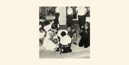 picture of blacks huddled on the floor